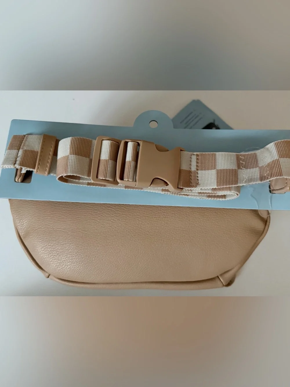 Cloud Island diaper sling in tan with checkered strap